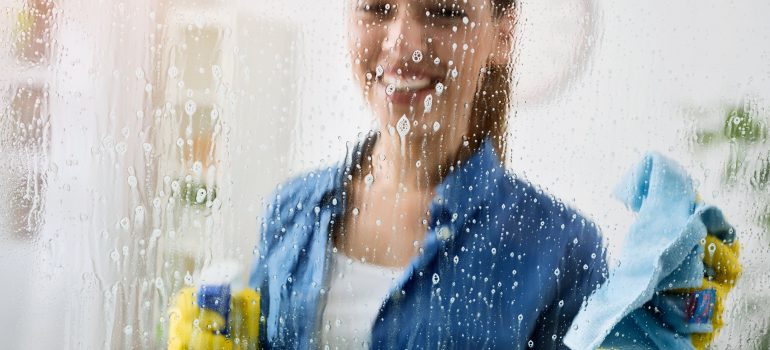 Woman cleaning windows